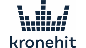 Ein modernes Logo mit dem Schriftzug "kronehit" und einem stilisierten Kronenmotiv. Die Farben sind dunkelblau und schwarz.